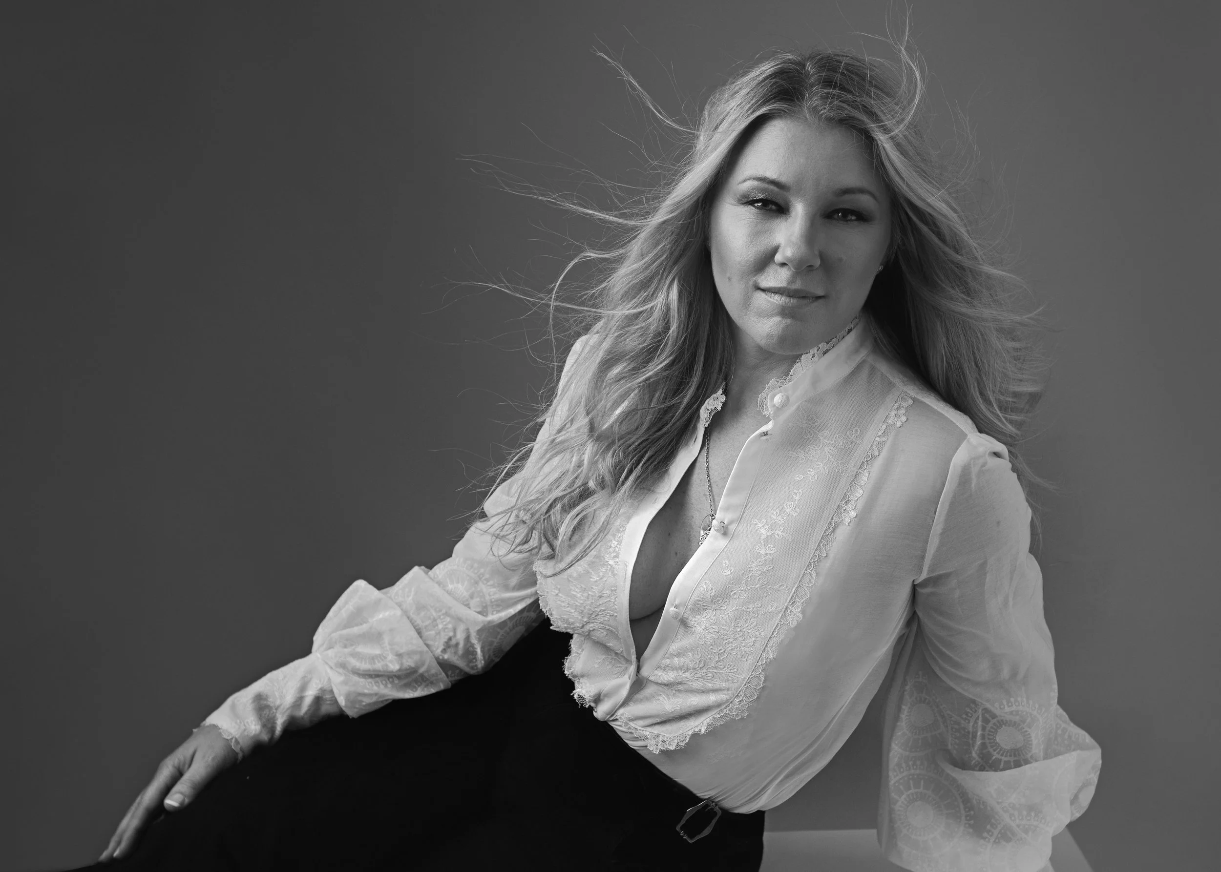 Personal branding photography London portrait of confident woman expressing feminine strength and presence