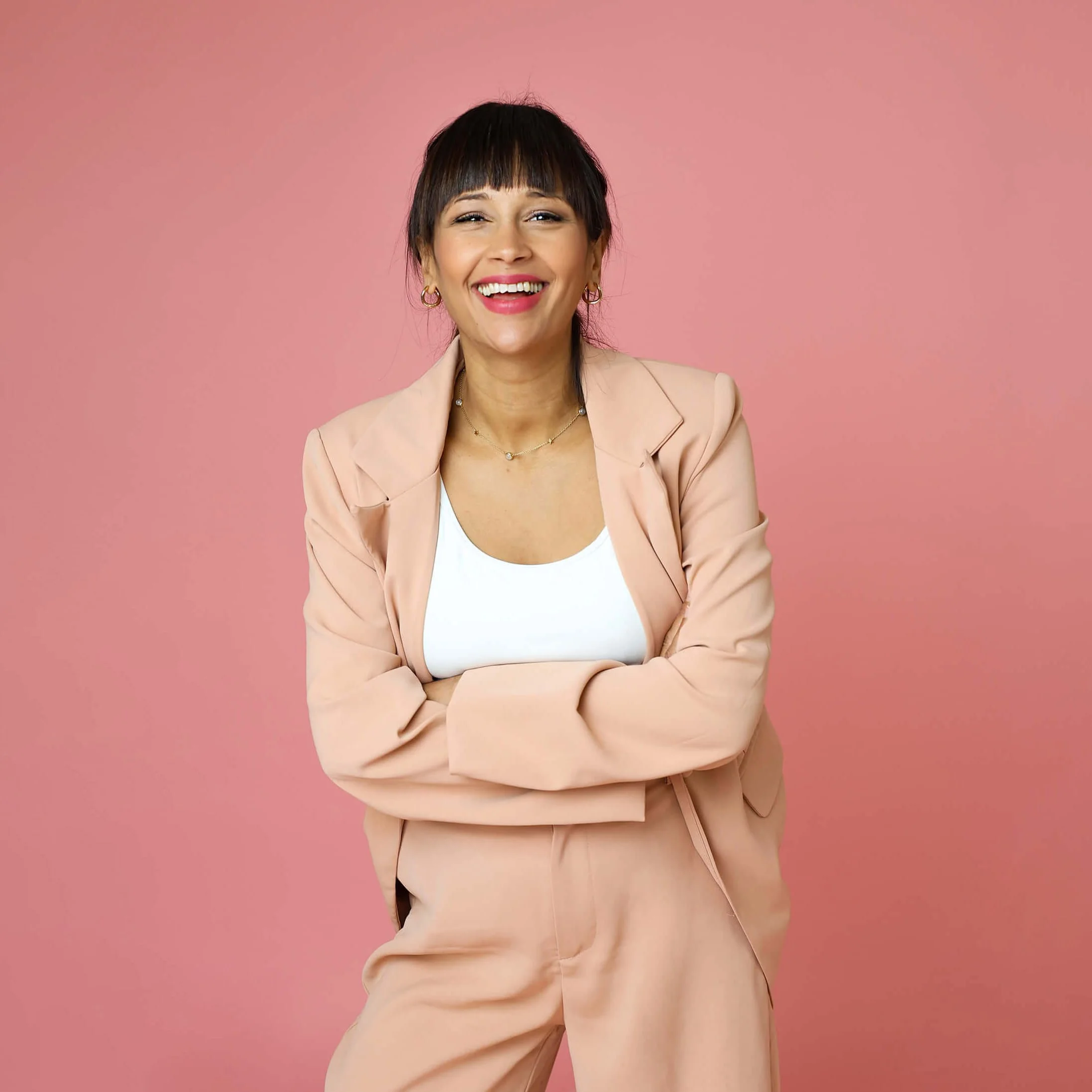 Personal branding photography London portrait of confident female entrepreneur smiling in studio