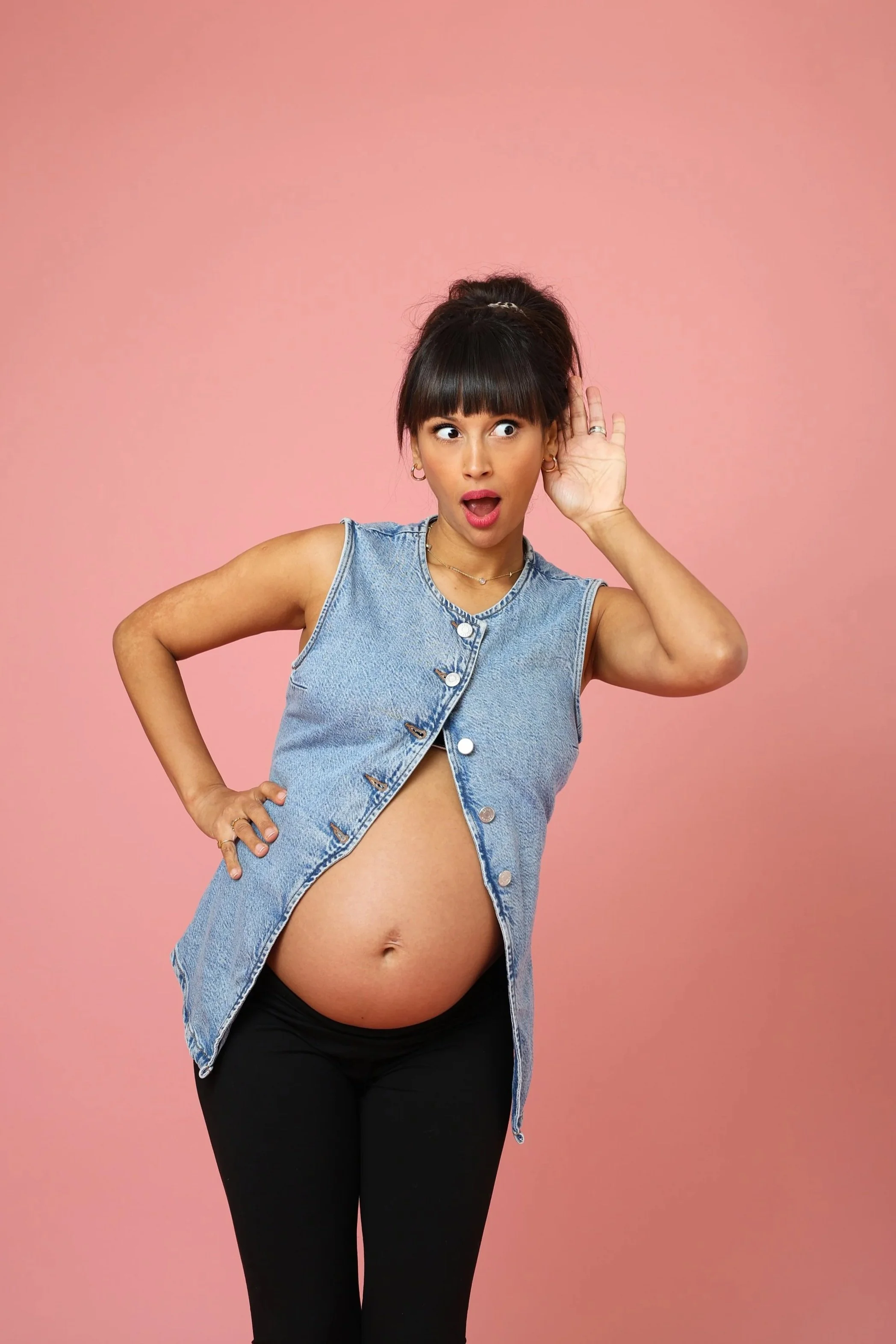 Personal branding photography London session with female client in playful, expressive pose