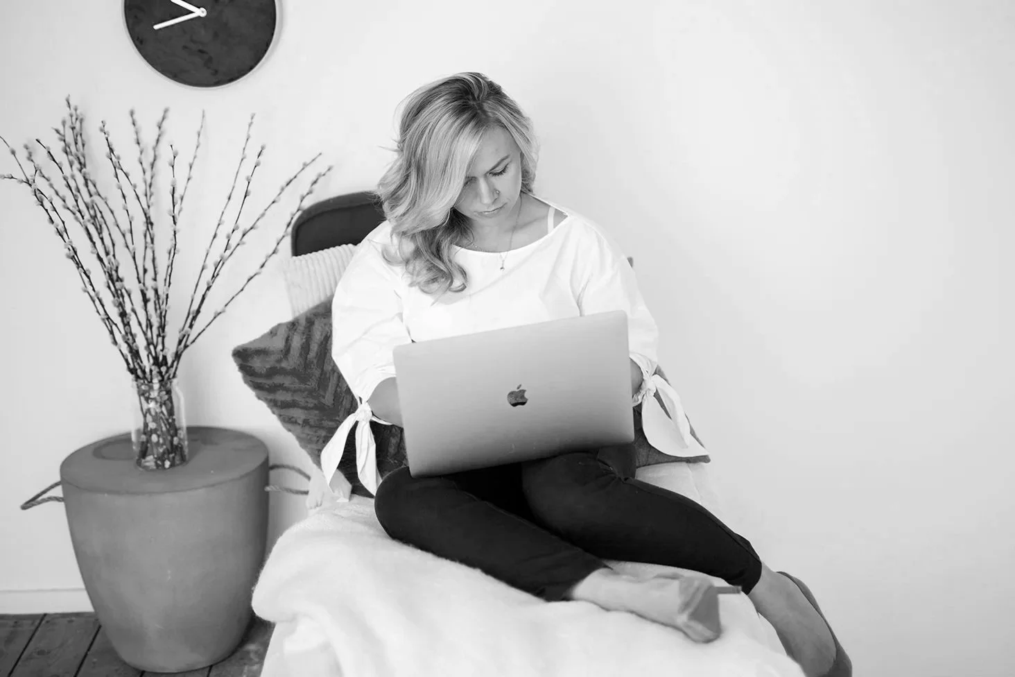 Personal branding photography London showing female entrepreneur planning and working on laptop during brand strategy session