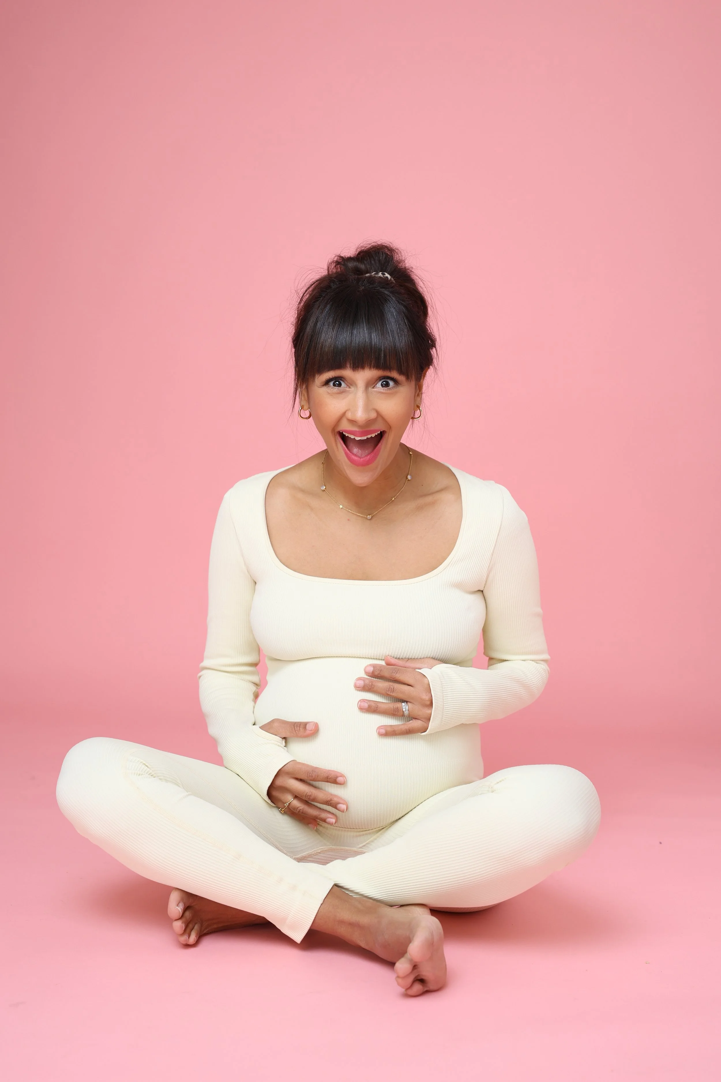 Personal branding photography London showing female entrepreneur and doula in relaxed seated portrait