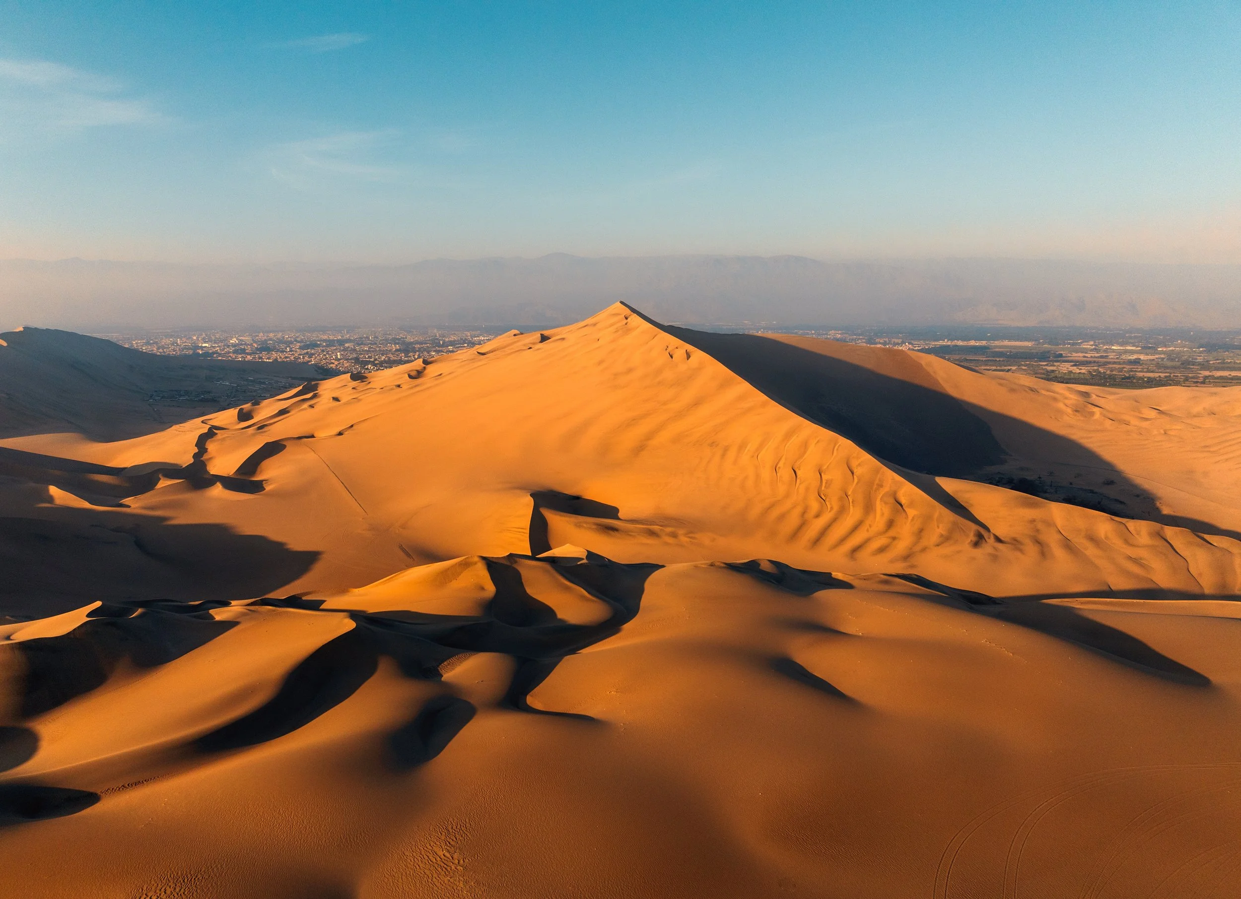 Aerial view of sand dunes at sunrise
