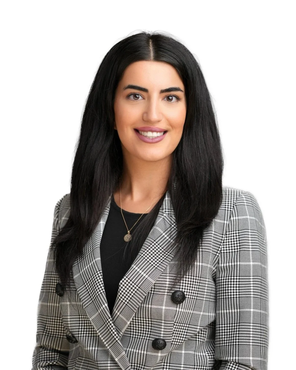 A woman with long black hair, smiling, wearing a black top and a gray checkered blazer with black buttons against a white background.