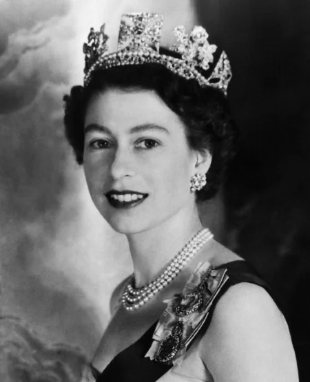 Image from Google - showing Queen Elizabeth wearing her signature triple strand pearl necklace.