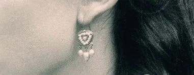 The pearls in this picture are fully drilled. My client preferred the ones we had in stock. So we made a small change in the design and added half drilled pearls.