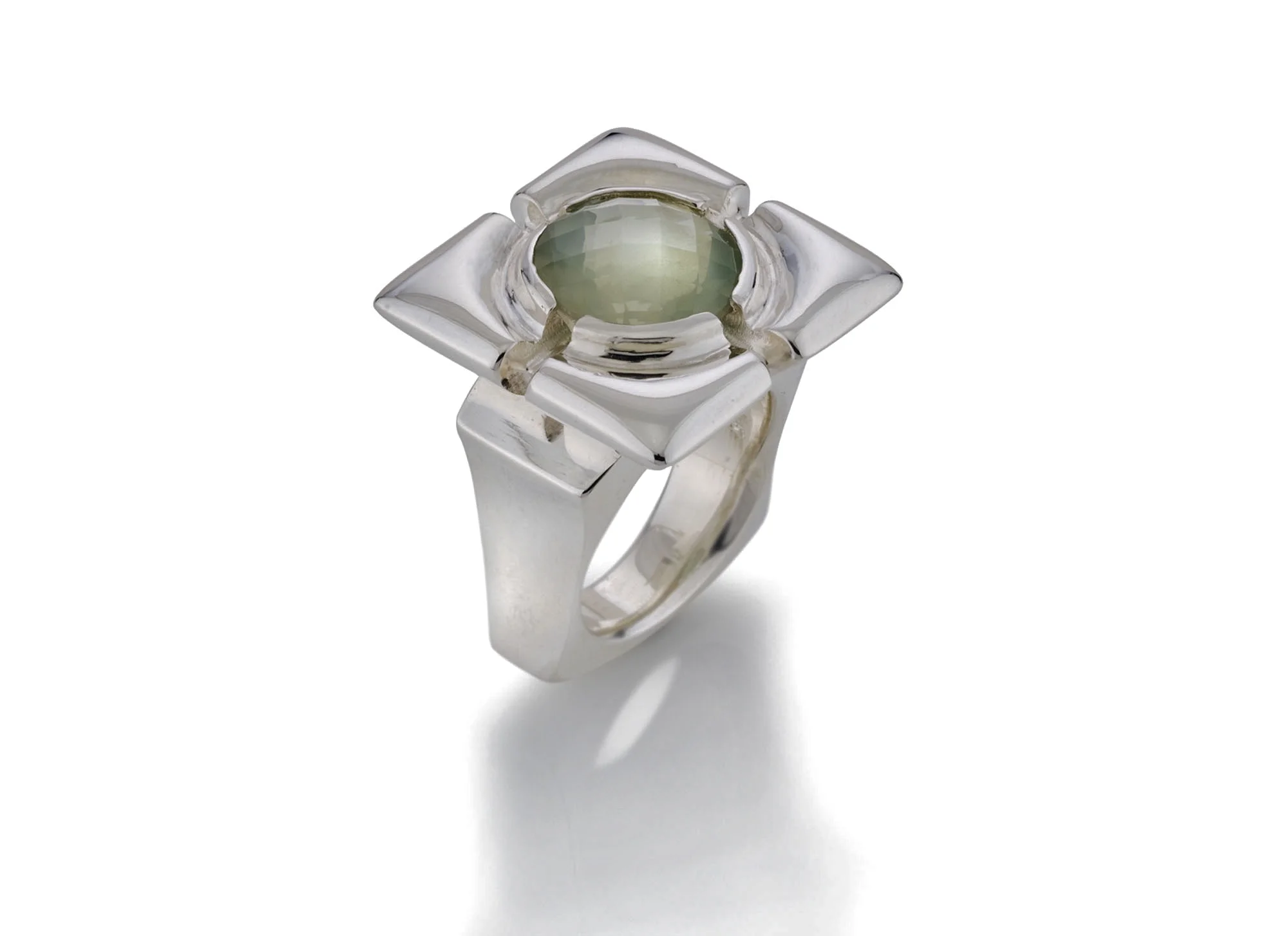 Shown here is a checker board cut moonstone cabochon, set into a sterling silver frame ring. A one of a kind design by Kathleen Lynagh Designs to highlight the gemstone's fine qualities.