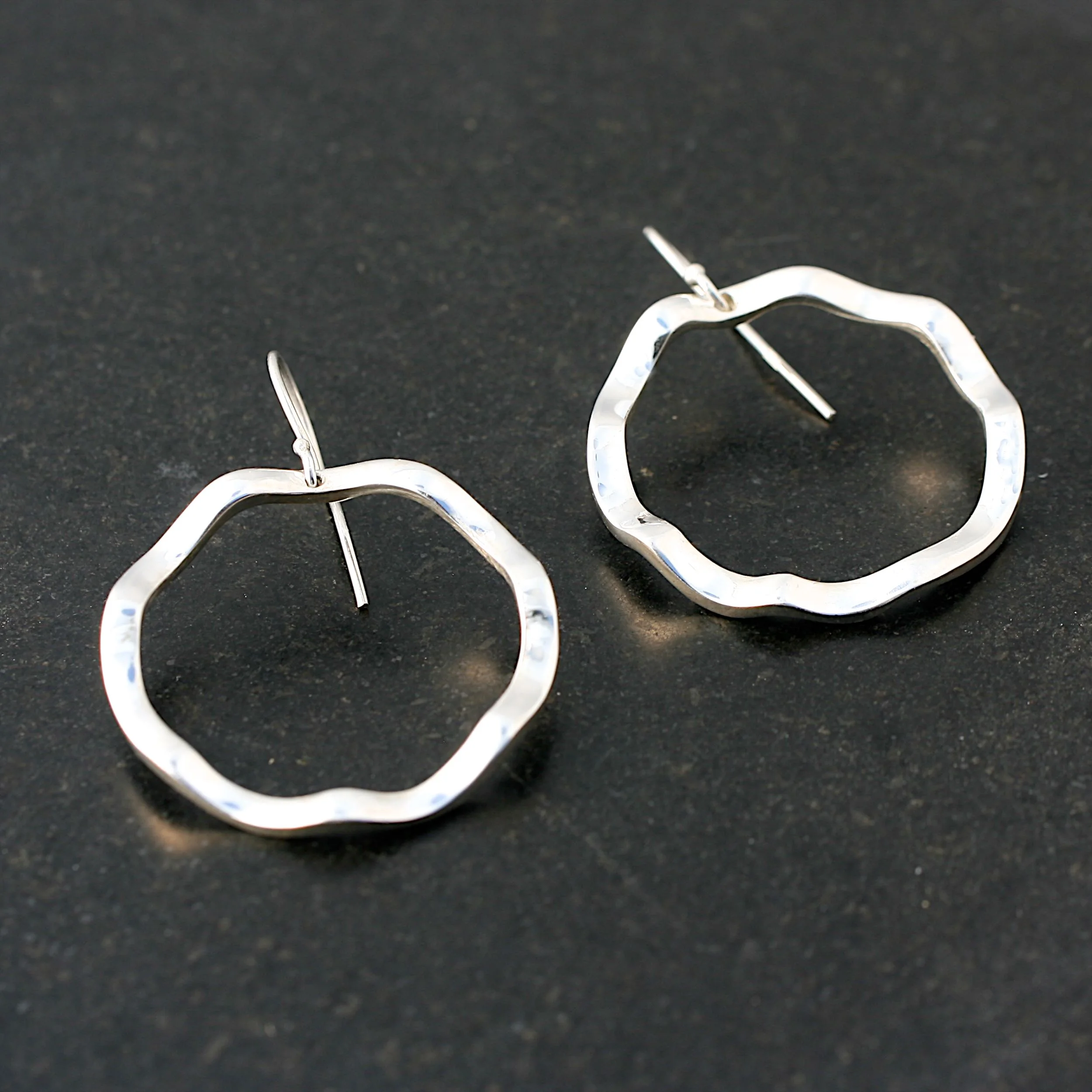 battered silver earrings