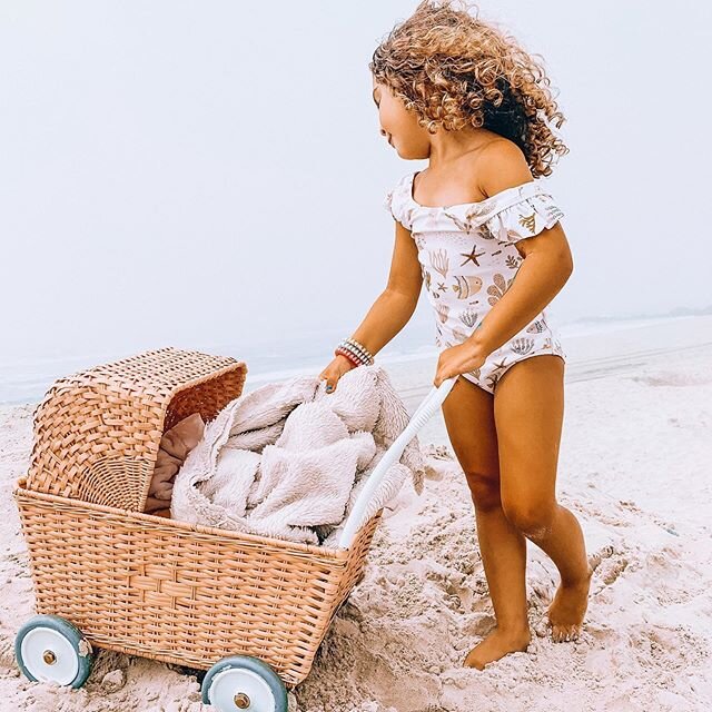 Taking care of babies at the beach is hard work, but this little lady sure does make mommin&rsquo; look easy. ☺️
