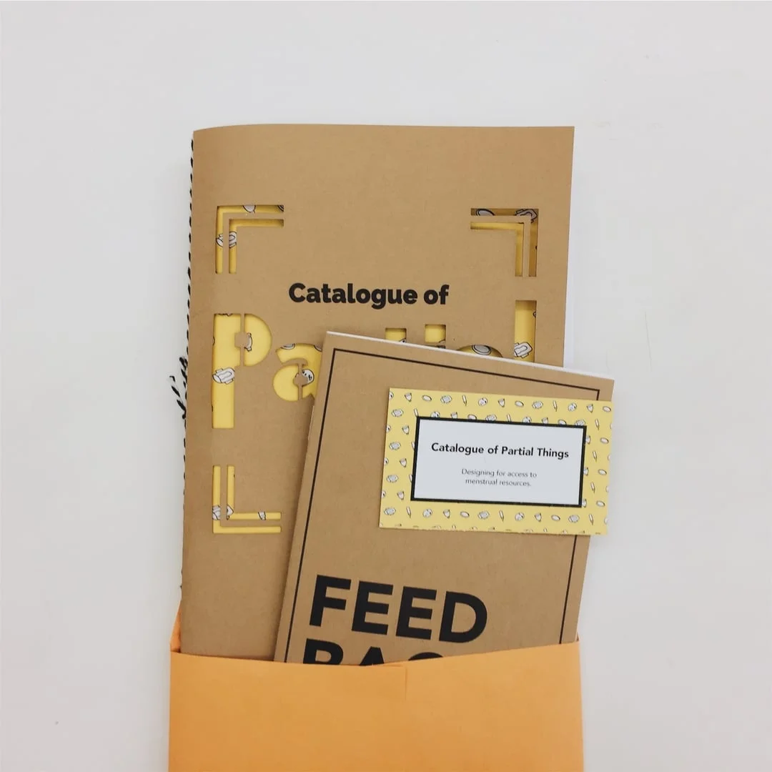 We put the catalogue with a feedback book and a business card inside of an envelope.