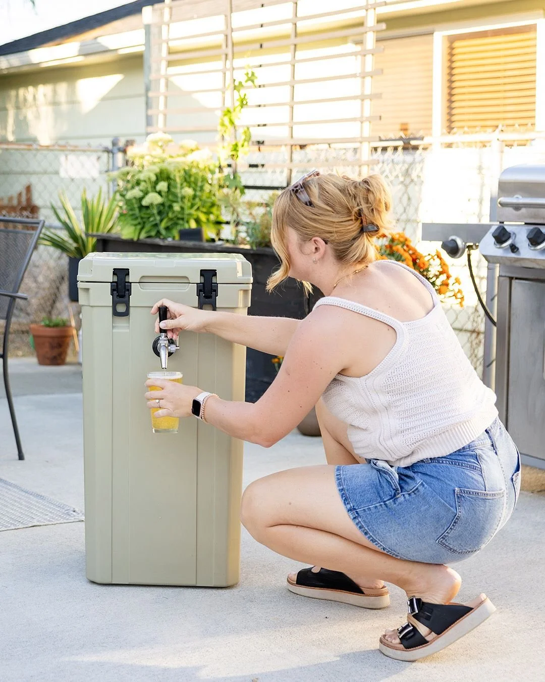When it comes to elevating a utilitarian product, the small details make all the difference. For this Brewcursion shoot, I swapped out the typical plastic party cups for real glassware and focused on a clean, modern patio setting. Even though this wa