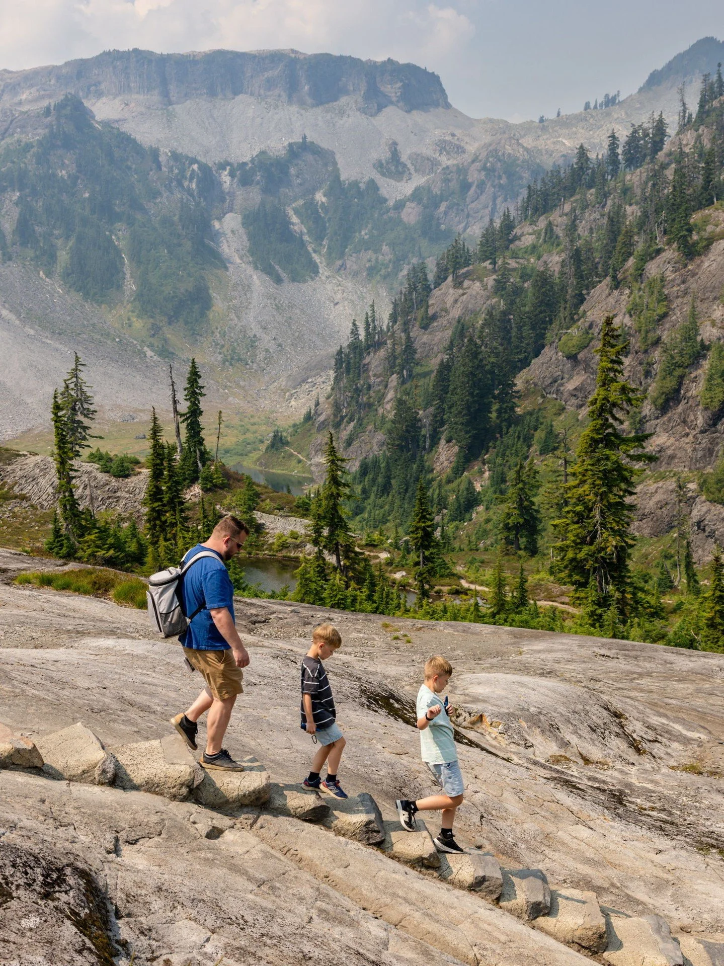 I have an ongoing series of images that I've dubbed "little people, big landscapes" that spans years of family adventures with my boys. 

The gist of it is this: once a year, I plan a trip somewhere in the PNW that is specifically designed 