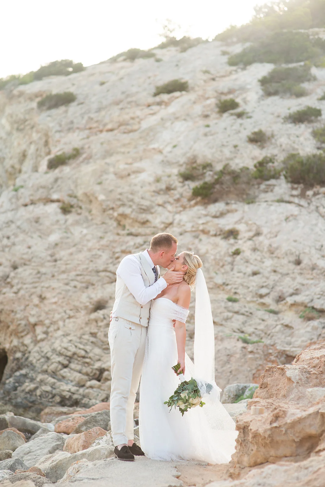 An off the shoulder Halfpenny London gown and Tilly Thomas Lux crown for a sun-soaked Ibiza wedding