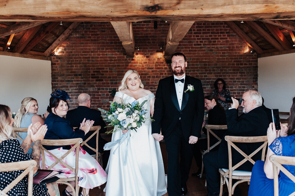 An off-the-shoulder gown and Tilly Thomas Lux hair clips for a Devon vineyard wedding