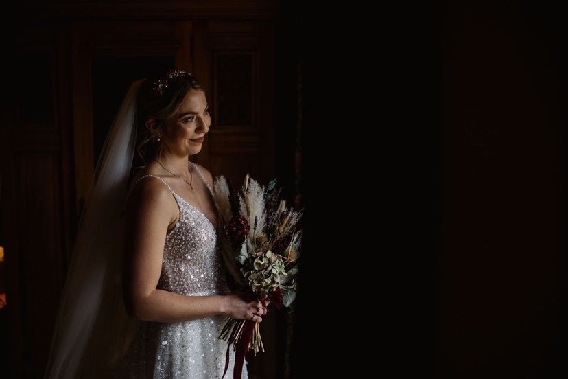 An embellished wedding dress and Tilly Thomas Lux Calypso crown for a glamorous wedding