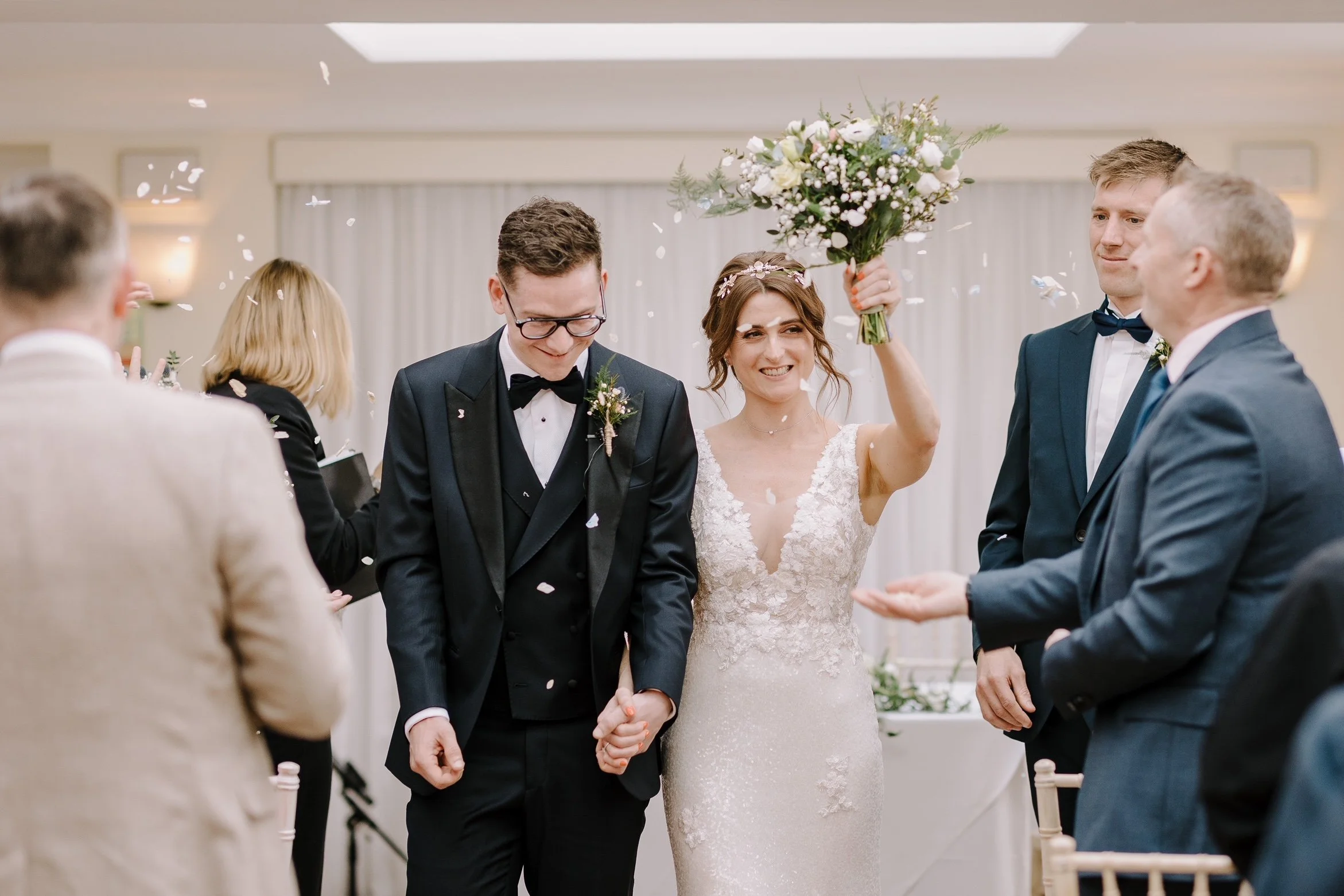 A backless, sparkly wedding dress and Tilly Thomas Lux Calypso headpiece for a Pembroke Lodge celebration