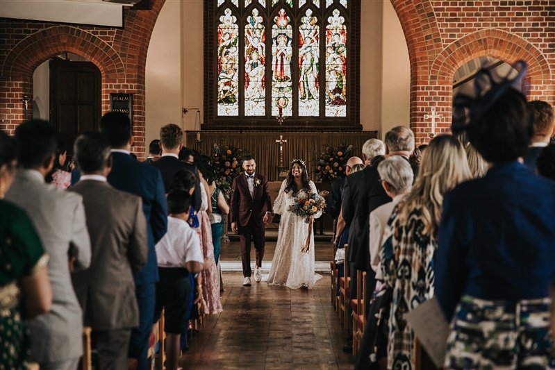 A Tilly Thomas Lux crown and stunning embellished wedding dress with sleeves for a glamorous wedding