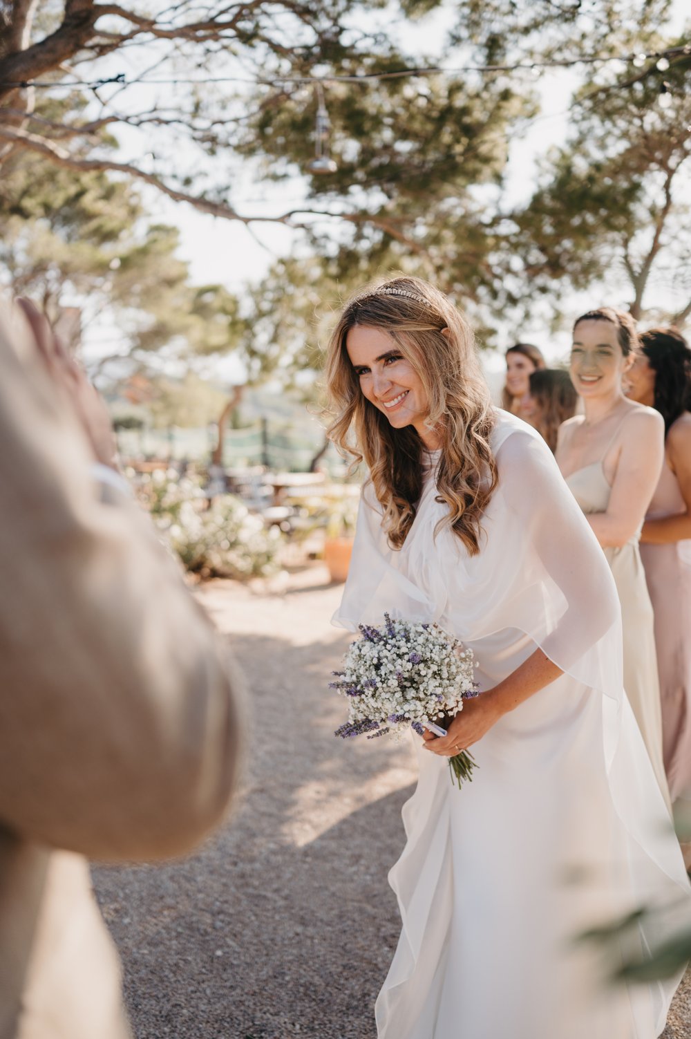 Stacked Tilly Thomas Lux crowns and a sheer cape for a stunning wedding in Croatia