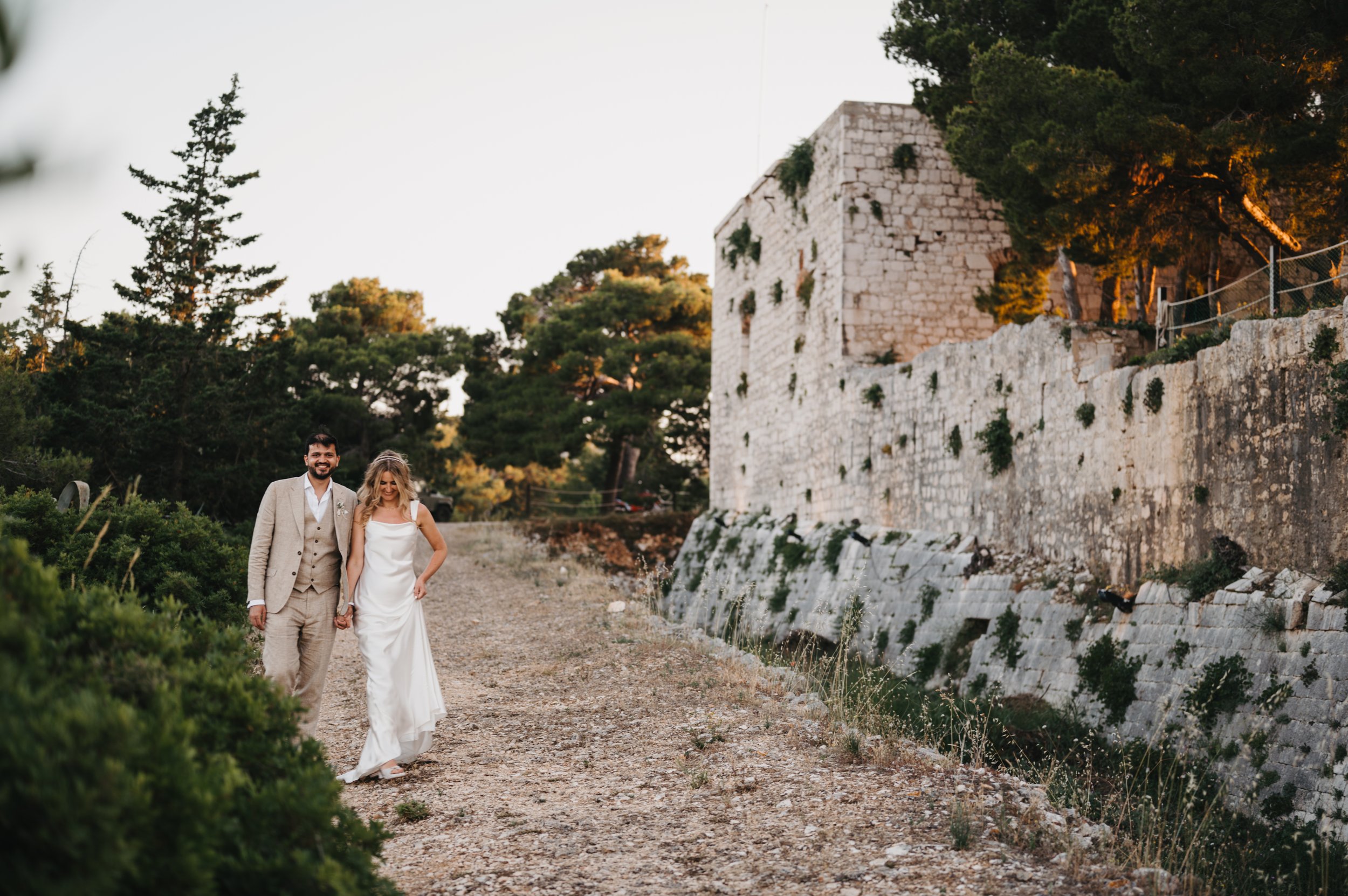 Stacked Tilly Thomas Lux crowns and a sheer cape for a stunning wedding in Croatia