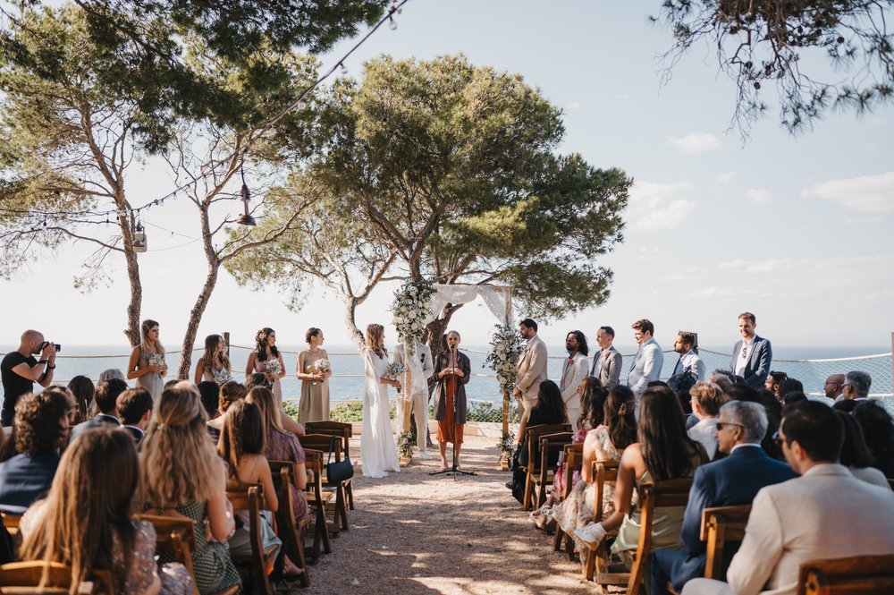 Stacked Tilly Thomas Lux crowns and a sheer cape for a stunning wedding in Croatia