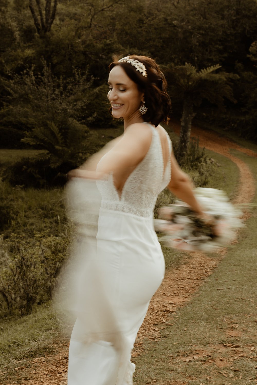 A Tilly Thomas Lux Ivy crown and matching leafy earrings for a stunning outdoor wedding