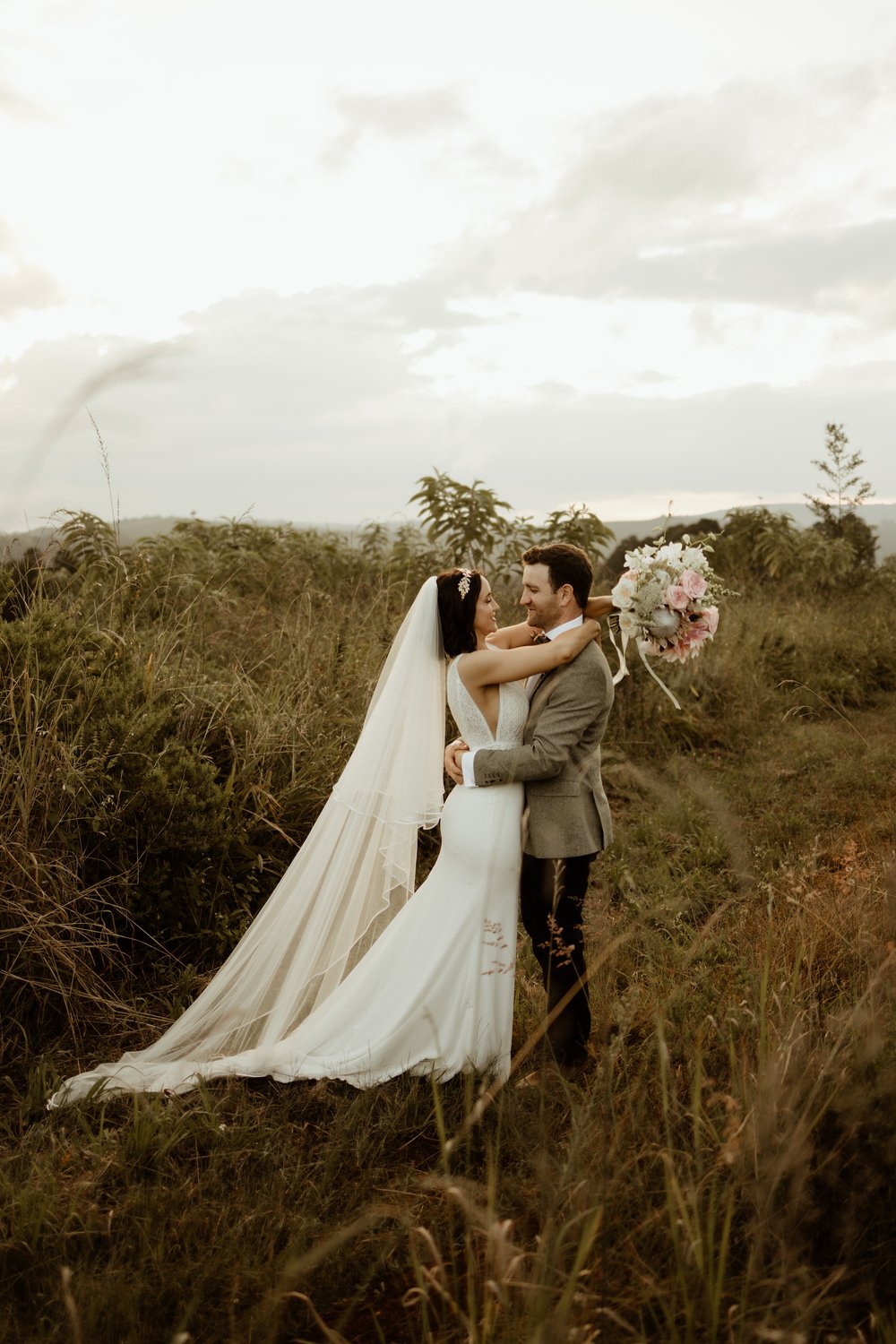 A Tilly Thomas Lux Ivy crown and matching leafy earrings for a stunning outdoor wedding