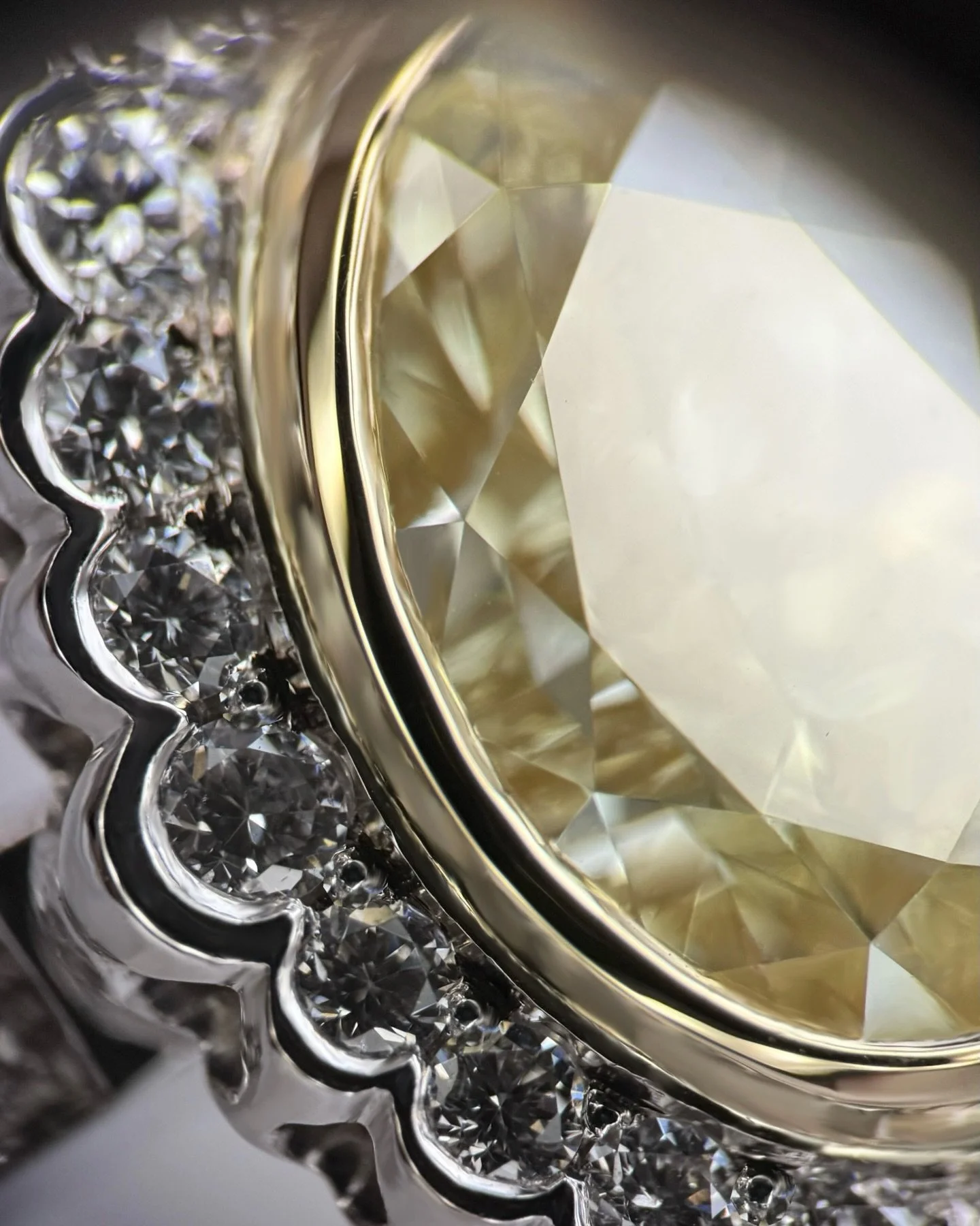 A truly special bespoke commission &mdash; a 1.75ct yellow oval diamond set in yellow gold to enhance its warm glow, surrounded by diamonds in a refined modern 18ct white gold setting.

Designed with care and handcrafted by our talented goldsmith fro