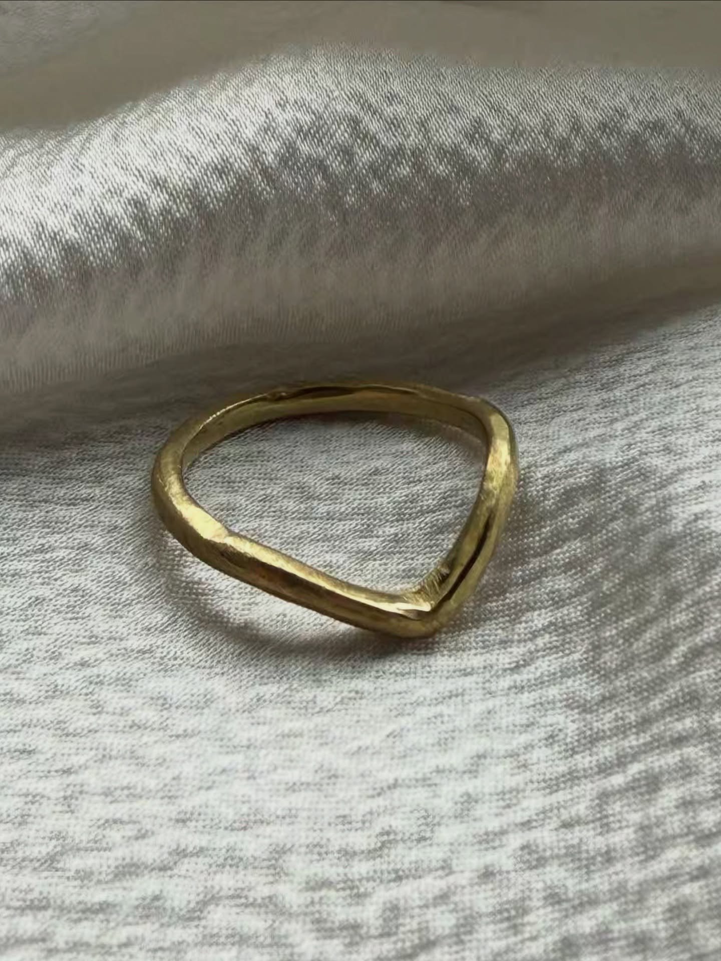 A beautiful husband-and-wife bespoke moment 🤍

The brief was to create a wedding ring that complemented her engagement ring &mdash; organic in feel, but perfectly shaped. We sculpted the design in wax first, before casting it in gold for the most na
