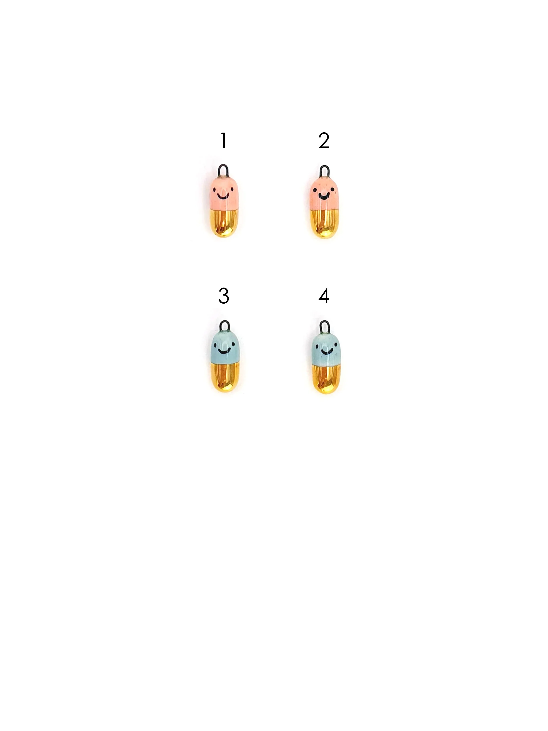 Happy Pill - colour and gold capsule with faces