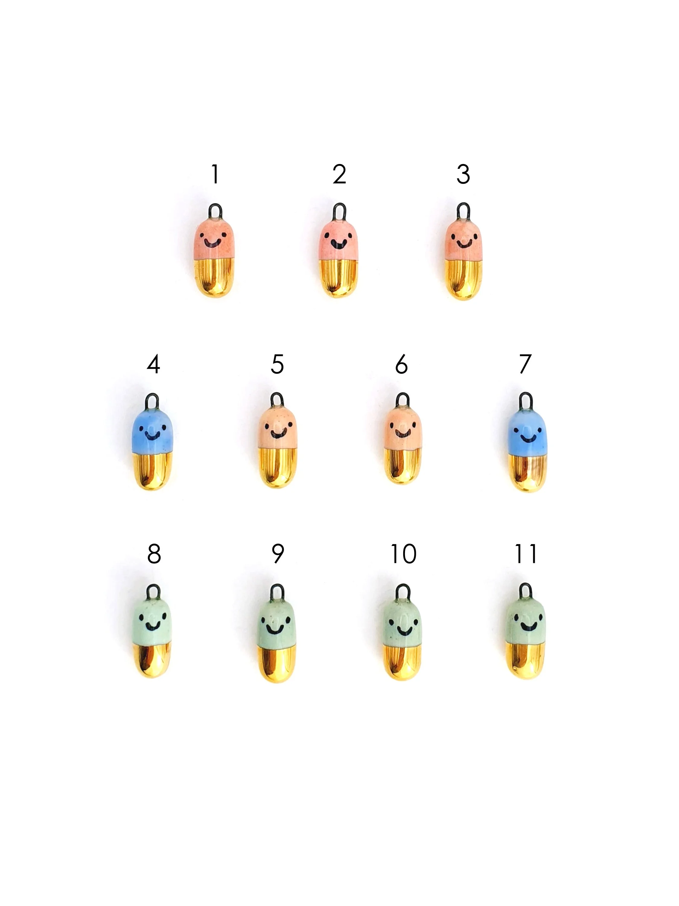 Happy Pill - colour and gold capsule with faces