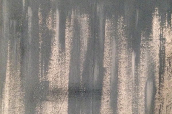 Vertical brushing. A good place to start for a run-down wall look.
