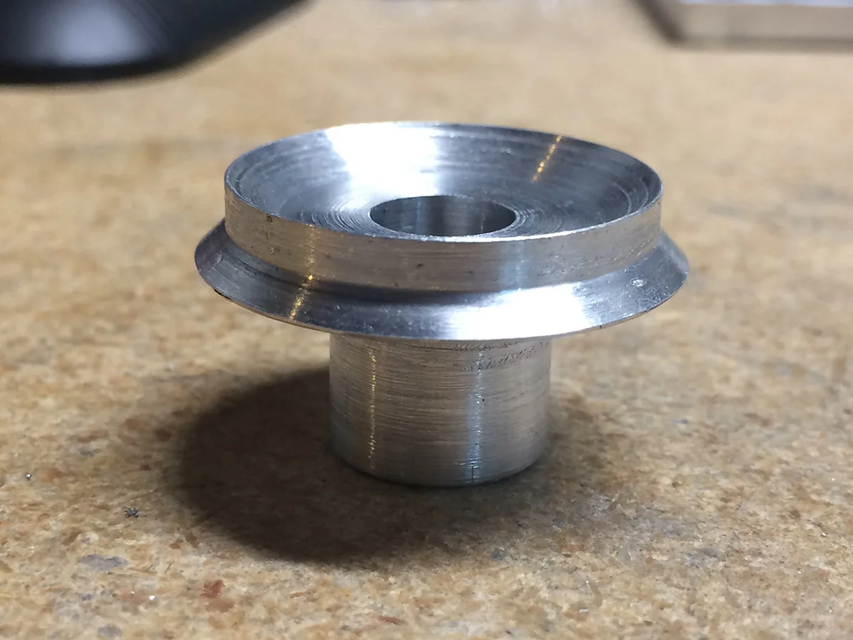 Rear barrel mounting flange