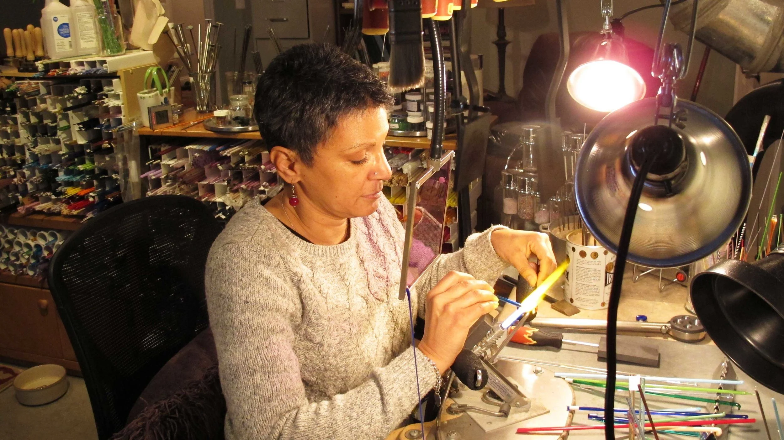  Vangie creating a glass cremation bead. 
