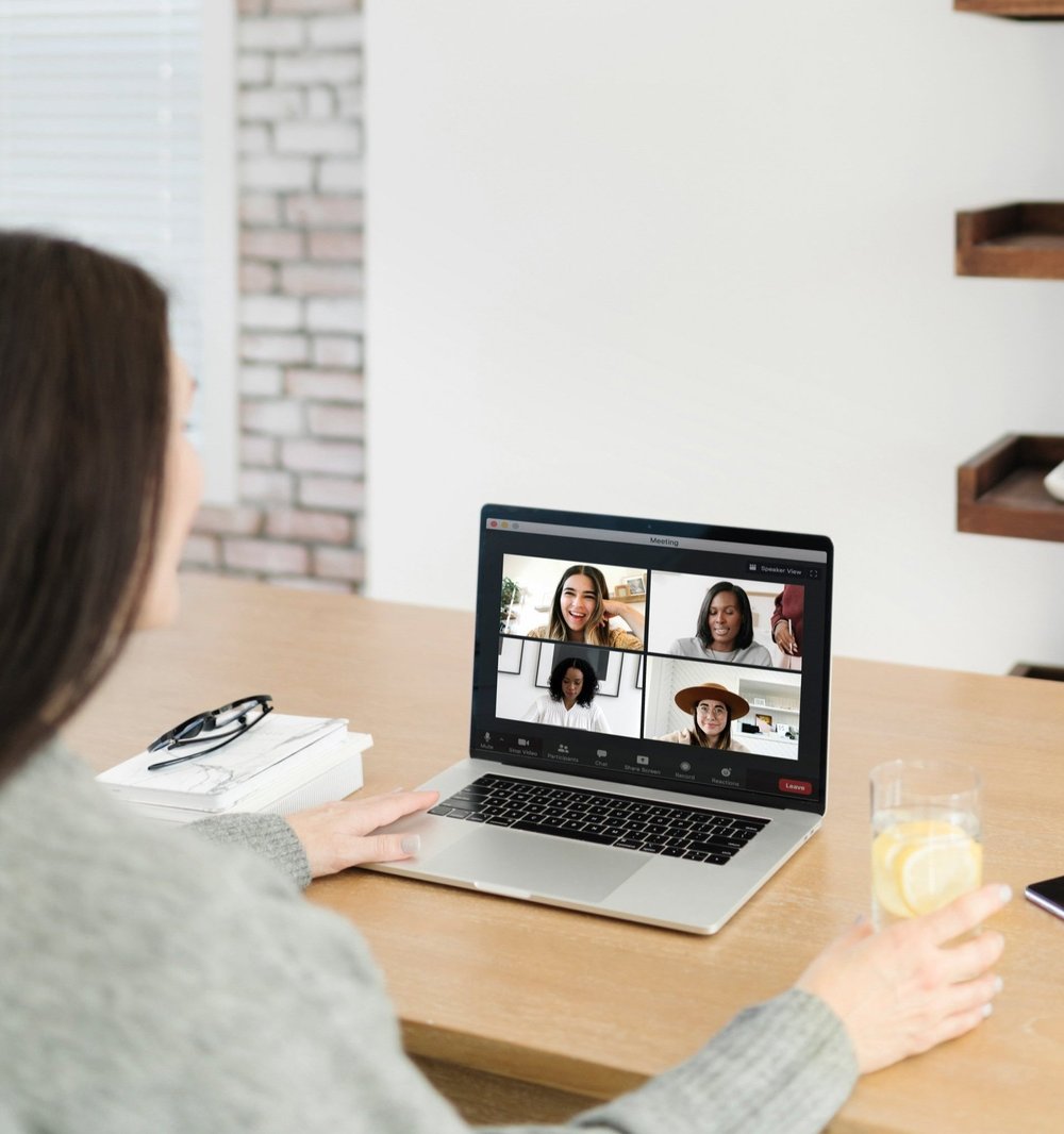 Woman joining a FemCity online coaching call from her laptop