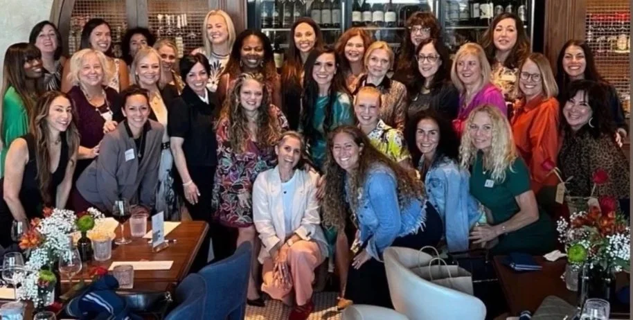 Women networking at a FemCity local chapter event.