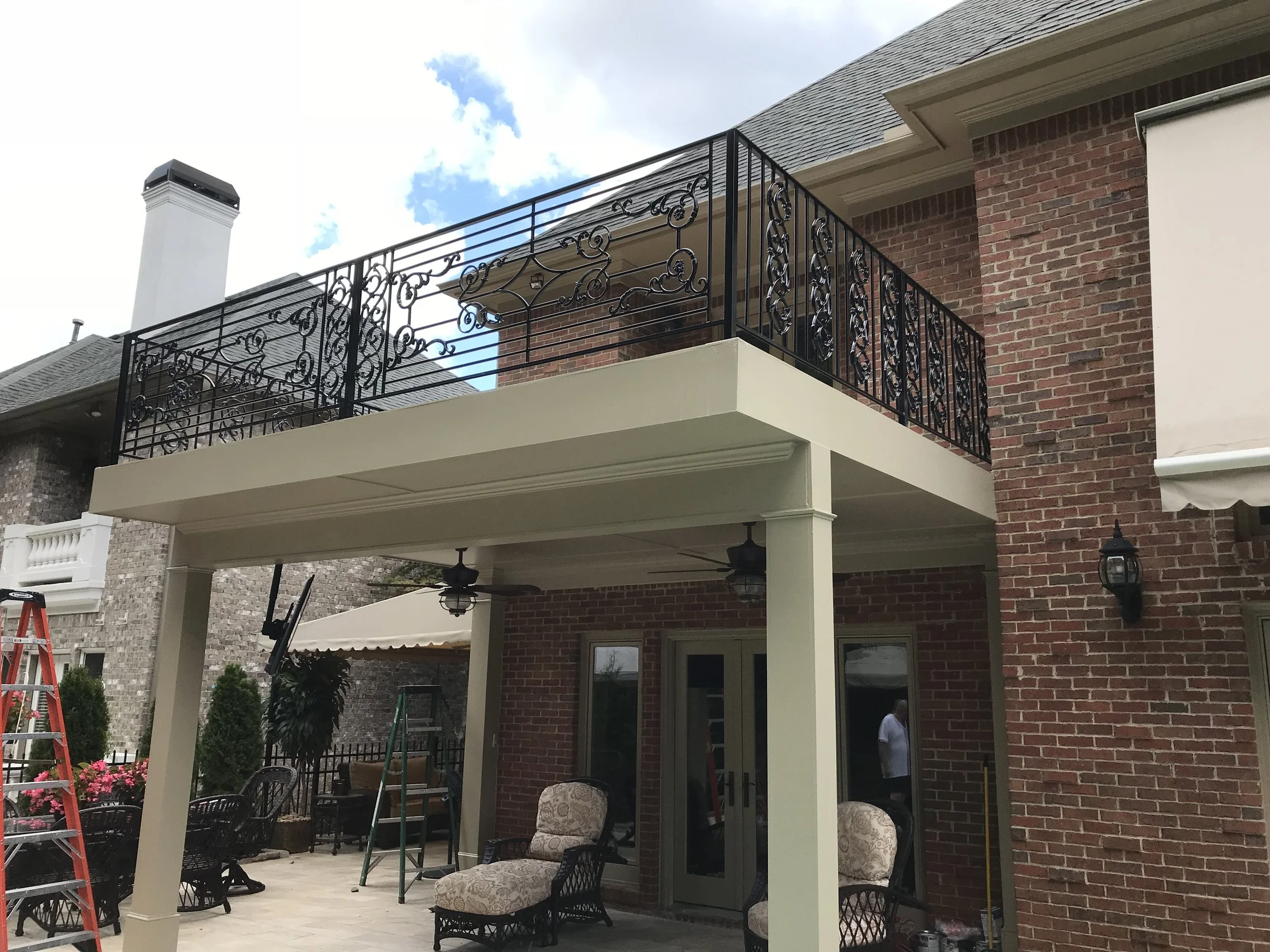 Custom handrails Main design re-purposed from wrought iron on their front door. (design does not meet GA code)
