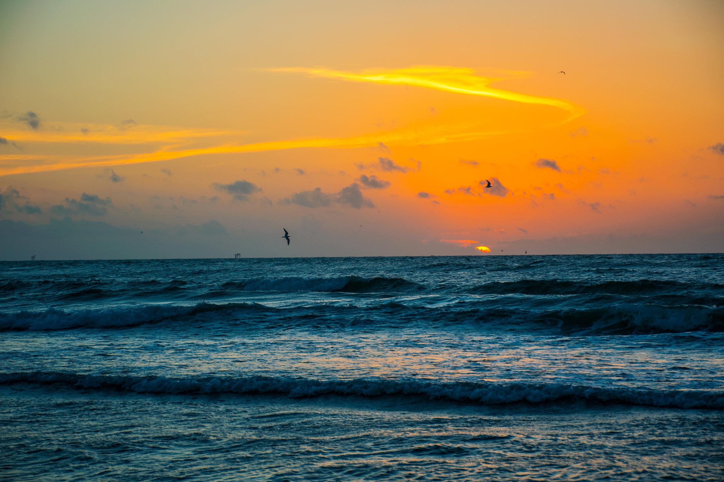 iStock-Sunrise Over Waves Crashing on Beach478831502.jpg