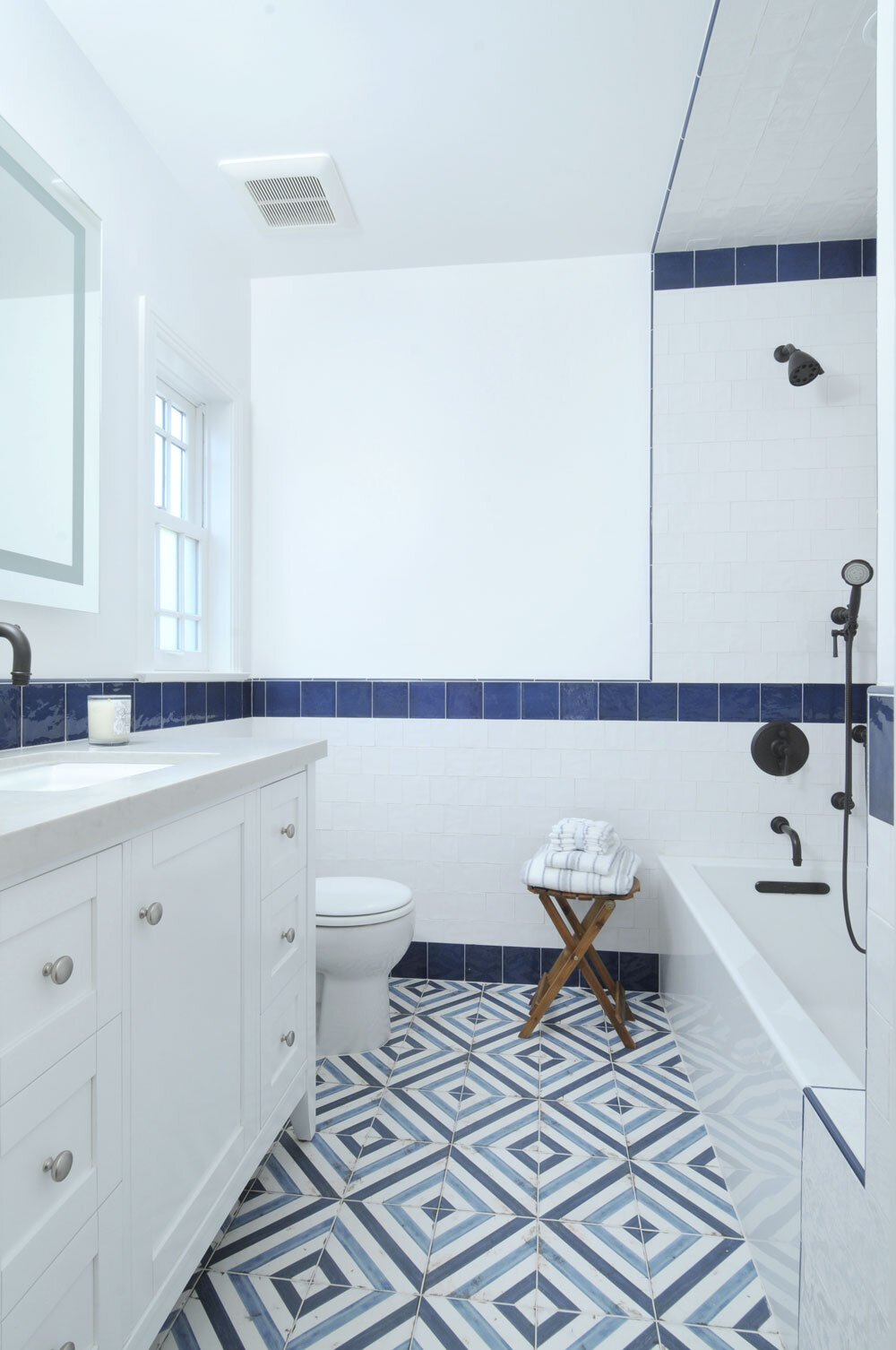 guest-bathroom-blue-white-tile-waterford-construction.jpg