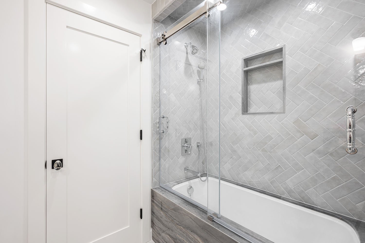 gray-tub-shower-herringbone-tile-waterford-construction.jpg