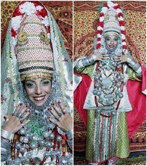 “Because the wedding ceremony lasts for three days, the bride will change three different outfits. Beforehand, during the cleansing and beauty treatments, the brides have to wear traditional green dresses; the next day, as they attend the hair dressers, they wear a red dress with gold strings. Every time they are in public, they need to wear different gold veils and gold jewelry. They have to wear as many as possible (must be really heavy!), actually, they have to wear every single piece of gold jewelry they possess. On their wedding day, the brides from Yemen usually wear gold and white veils and a marvelous and spectacular headpiece.”