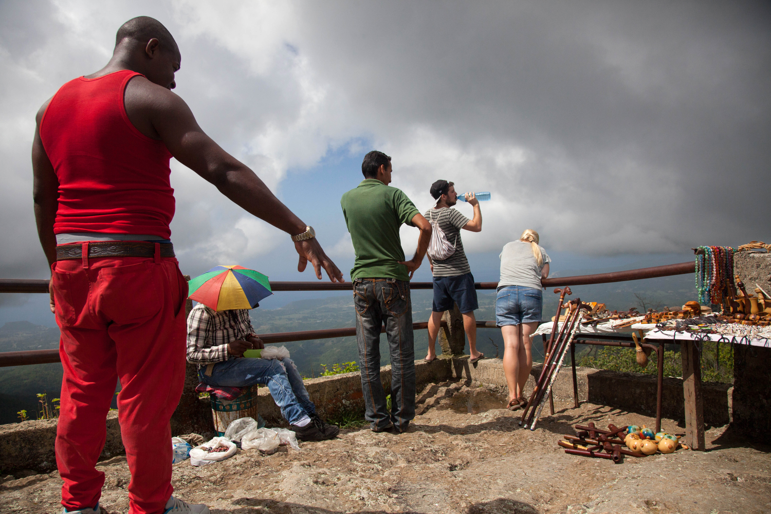  Locals and foreigners visit Gran Piedra after climbing over 45 stairs to stand atop the 70,000-ton rock with views of the Sierra Maestra mountains in Cuba. The lights of Jamaica can be seen from this spot on clear evenings. 