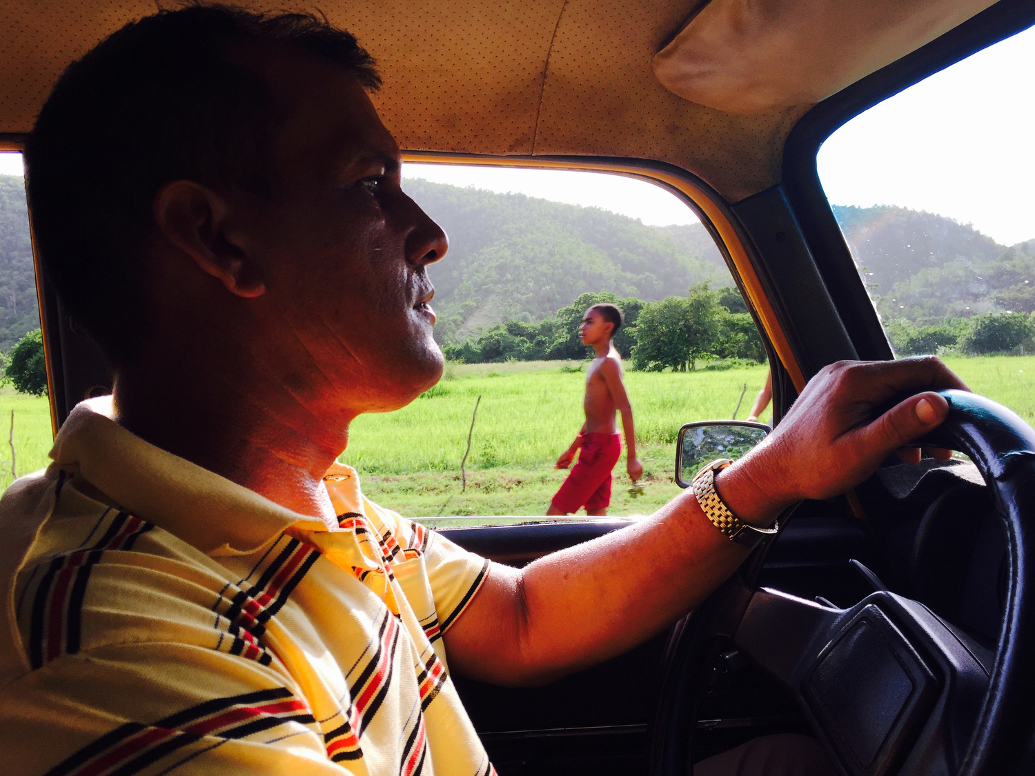  Antonio Hernandez drives a vintage car using a special permit allowing him to leave the city, and bring foreigners through small towns in the Sierra Maestra mountain region of Cuba. 