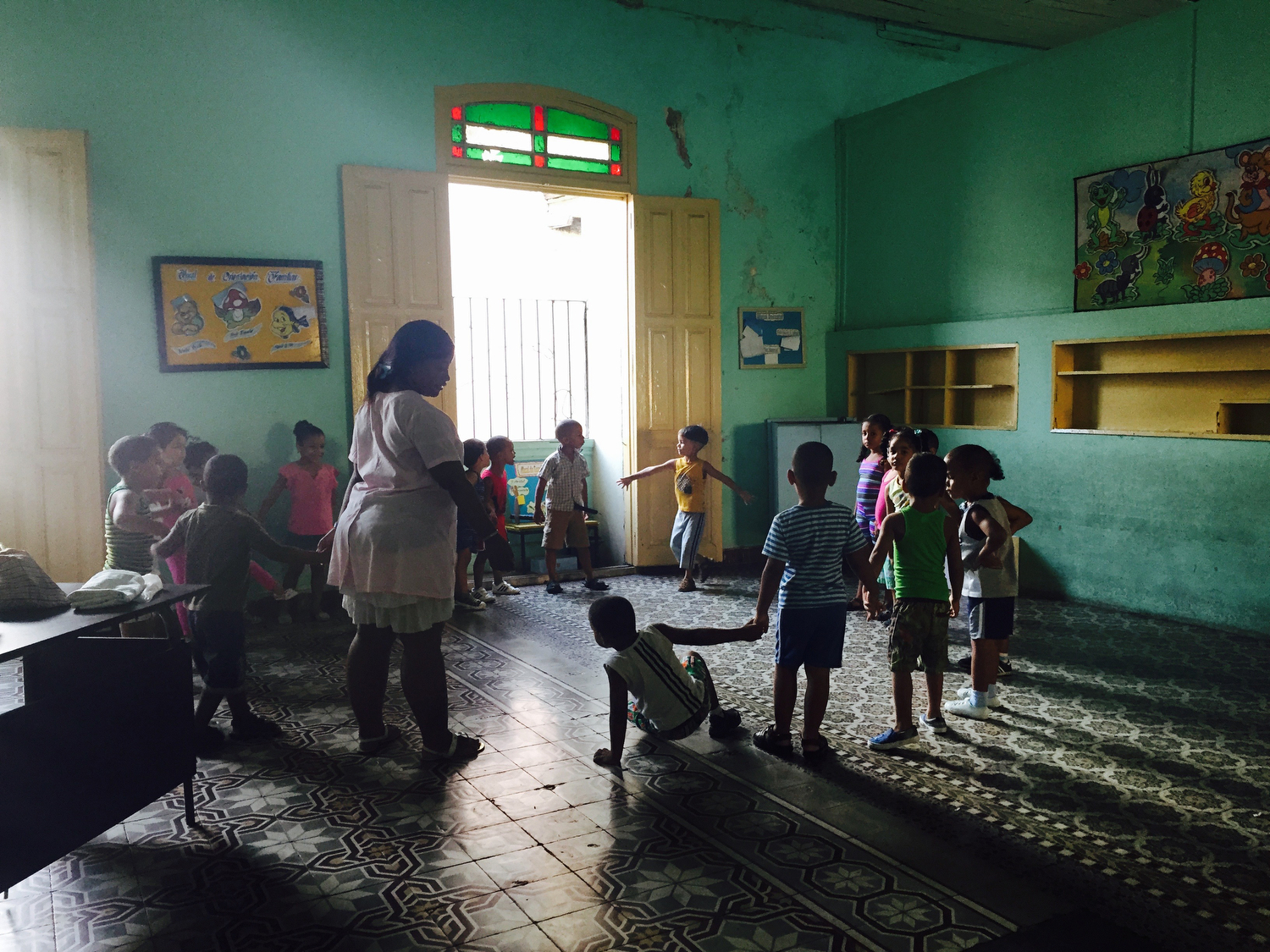  School is held inside a former mansion in Santiago de Cuba, where the wealthy were forced out years ago under the hand of Castro.  