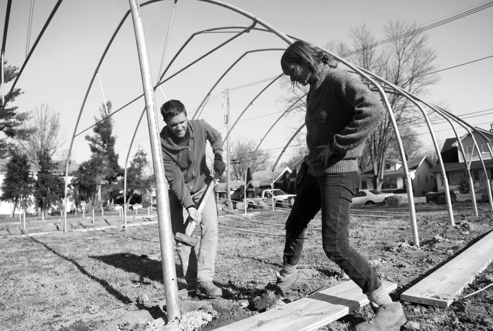 Brian Deis and Valerie Magnuson build a greenhouse to help a low-income area in Louisville, Ky. “If you don’t have control of your own food supply, what do you have control of,” Deis said.