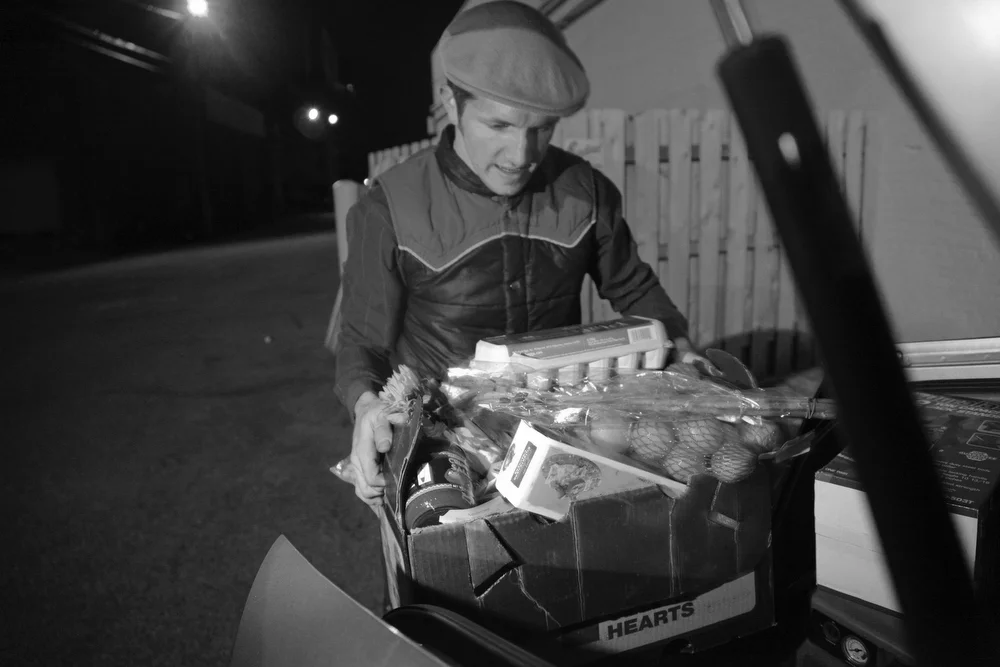 Brian Deis loads food tossed out by a local major grocery chain. “Our family isn’t going hungry, but there’s people who are, that don't know where they'll get their next meal,” he said.