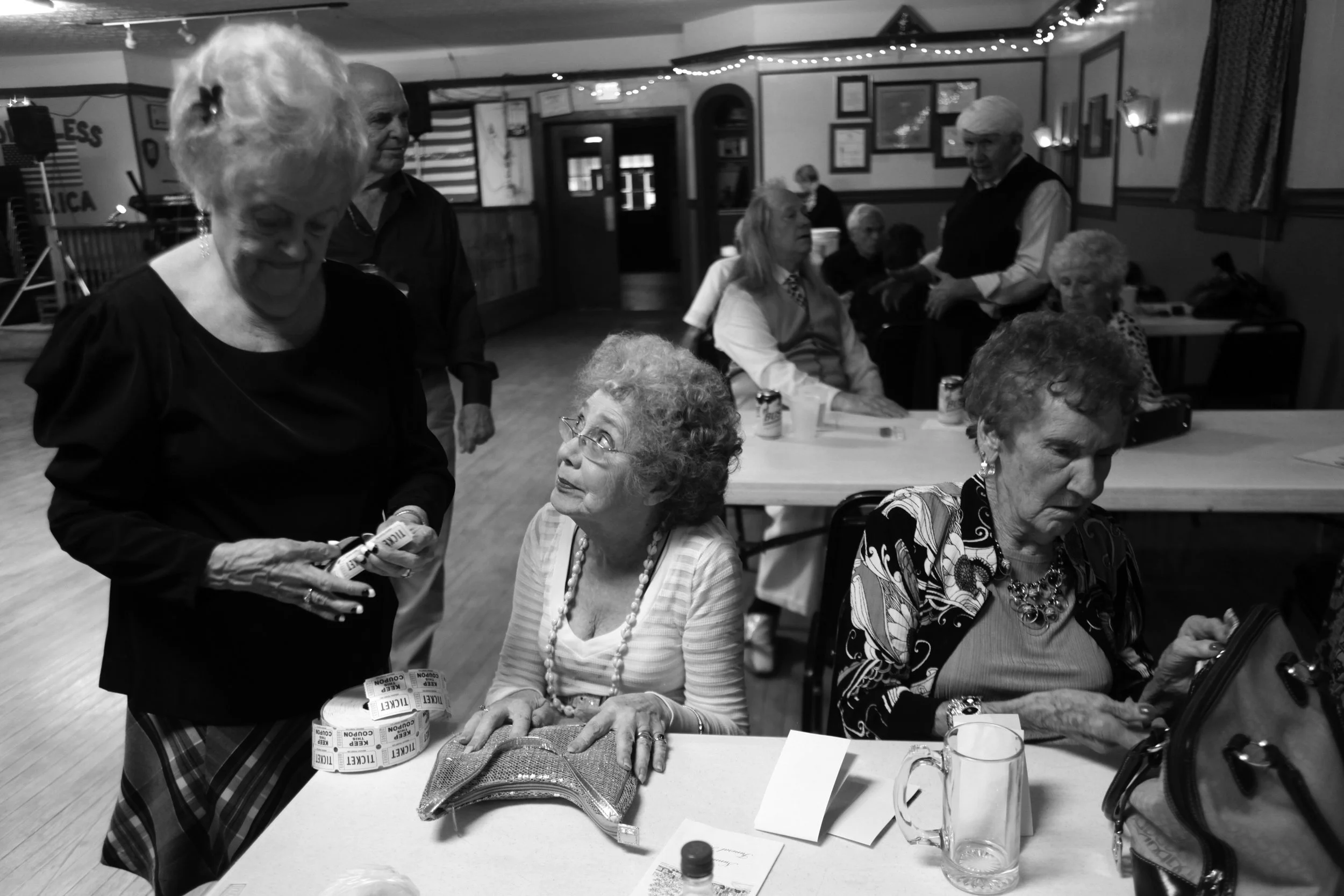 Dorris Hall sells raffle tickets to Mary Jean McCrary and Rosa Lee Charmoli. "It's a good place for people to meet and talk for camaraderie," Mary Jean said. 