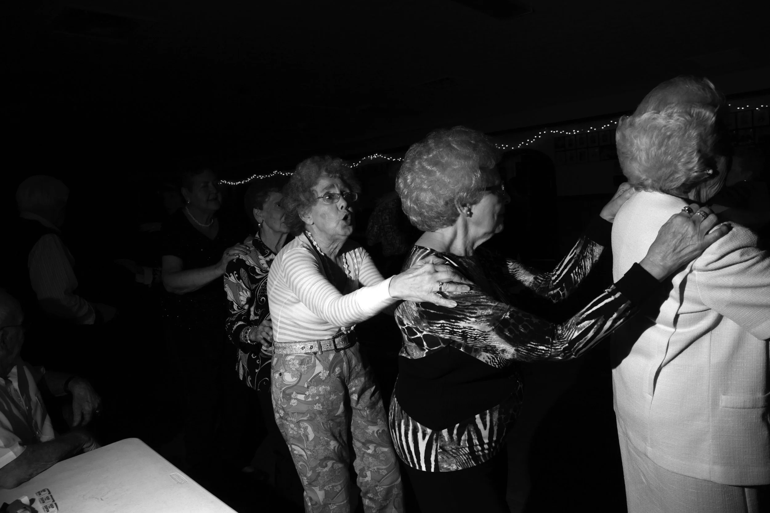 Johnny Klingensmith dances the "Choo-choo" with McCrary and friends since many outlive their husbands. "They don't have a partner, and I can't dance with each one, so I put them in a group," he said.