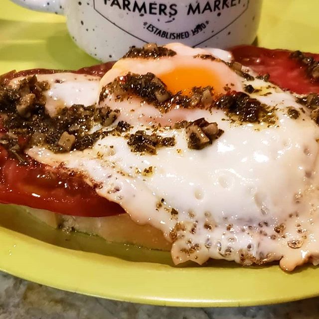 Sprout and Blossom's heirloom tomatoes, farm fresh egg, River Wave Foods Chimichurri on top of Columbia sourdough toast . Farmer's Market Breakfast.Yum!