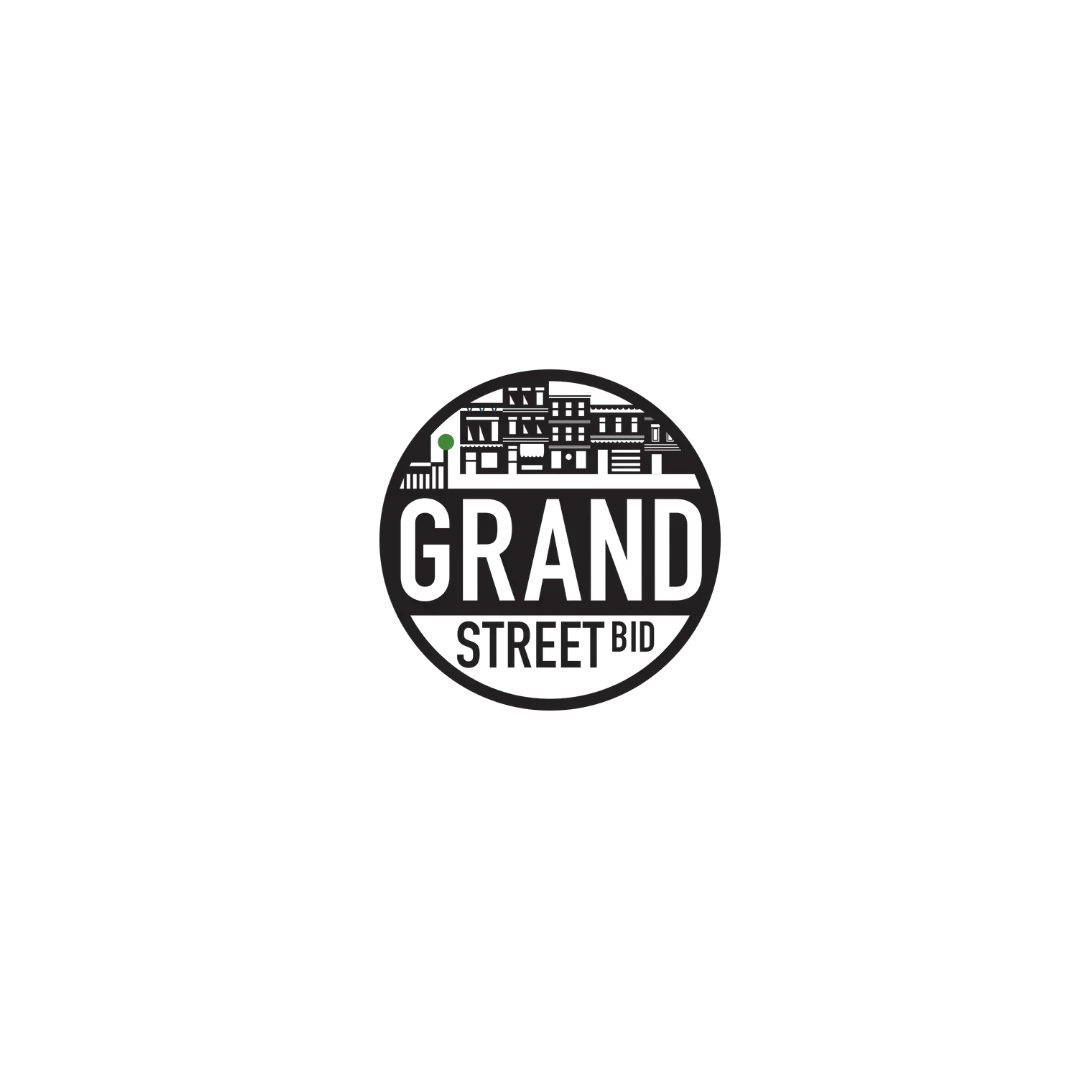 Black and white round sign with a cityscape illustration, the text 'GRAND STREET BID' in the center.