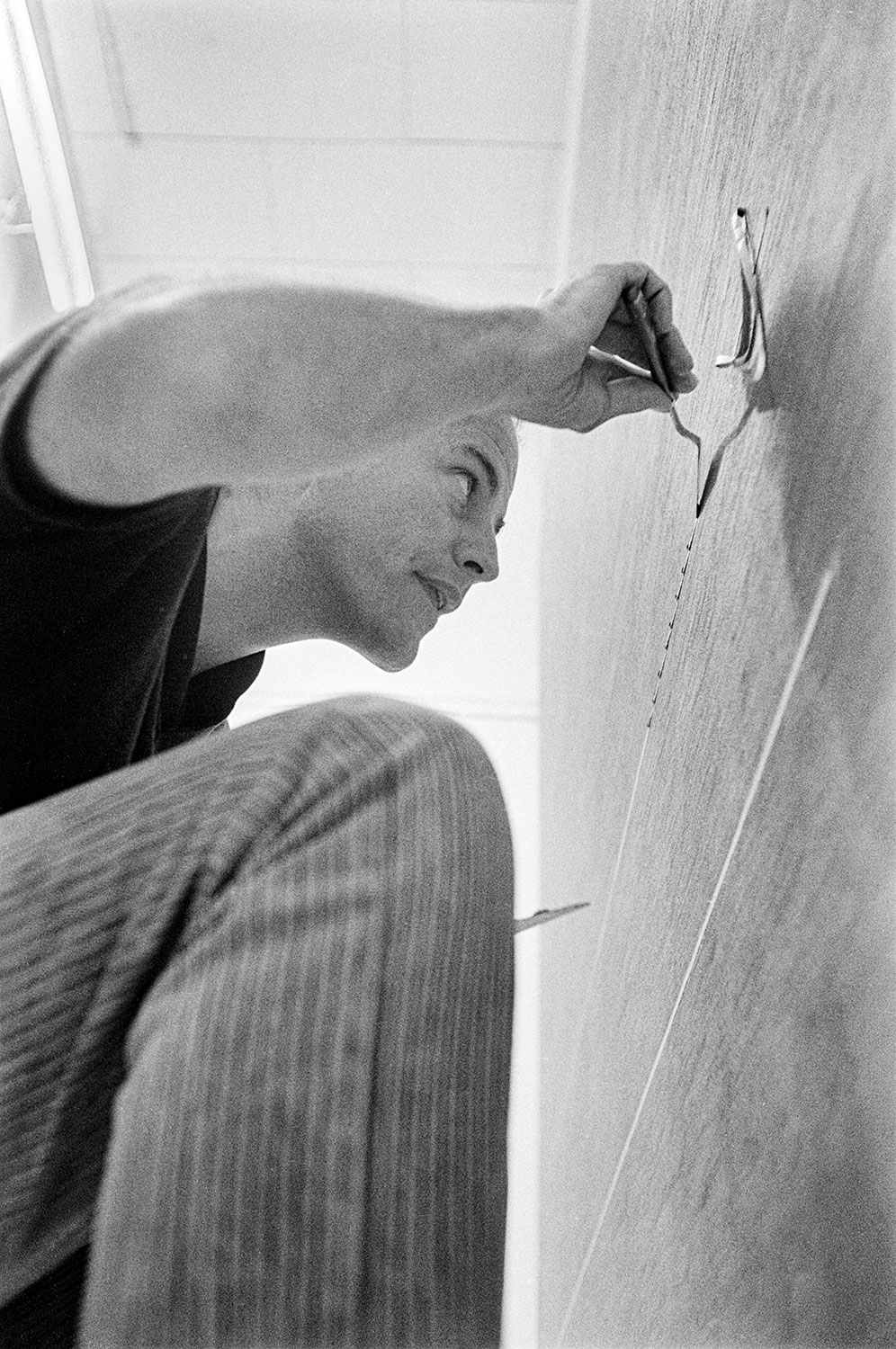  ROBERT IRWIN   Working on an early line painting, Venice, California, 1962    