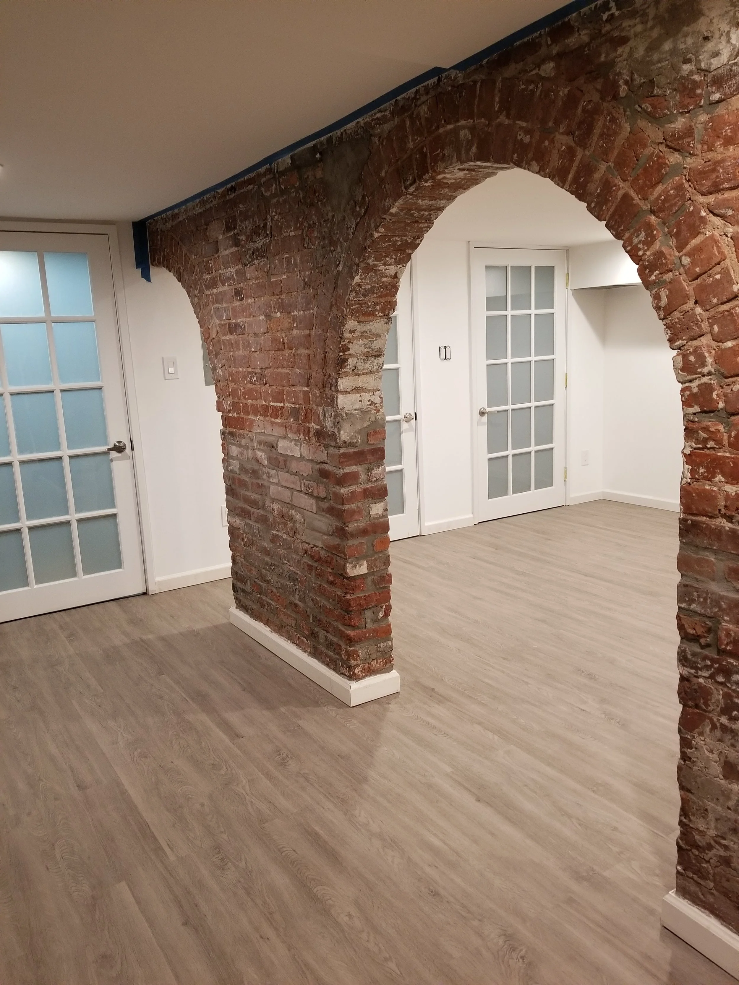 Rec room arches from stair.jpg